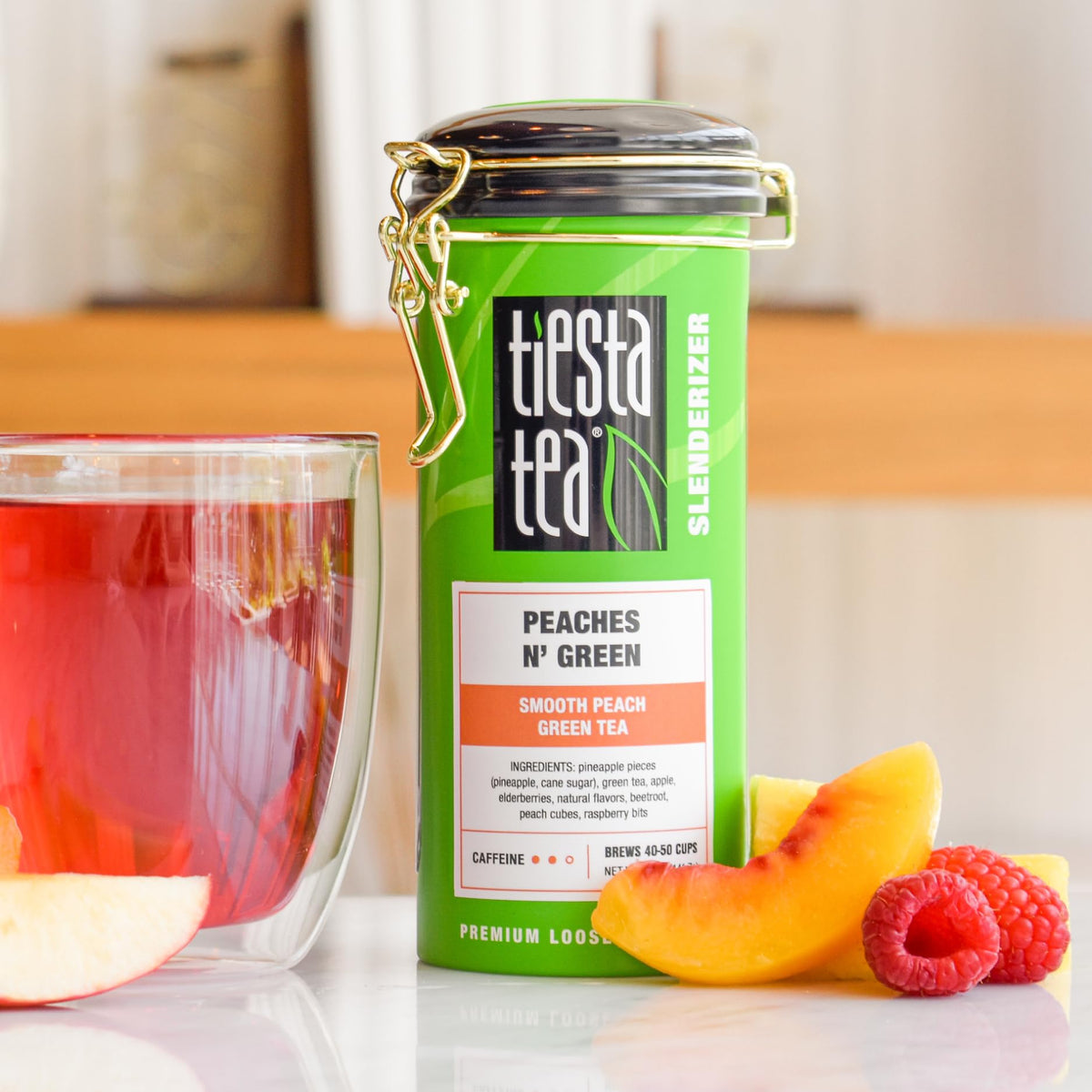 Tiesta Tea Peaches N' Green tea leaves close-up, premium loose leaf quality.