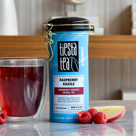 Close-up of Raspberry Razzle ingredients with hibiscus and berries.