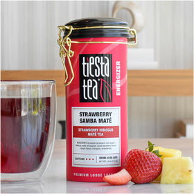Steaming hot cup of Tiesta Tea Strawberry Hibiscus Mate enhances study sessions.