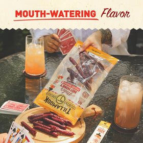 Tillamook Country Smoker Mikes Hot Honey beef sausage on grill during outdoor cooking