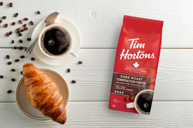 Tim Hortons dark roast brew steam in mug, ready to energize your day.