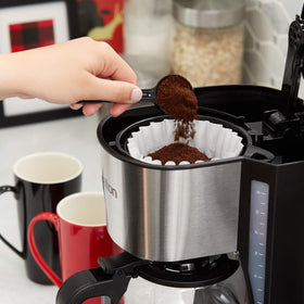 Tim Hortons dark roast ground coffee beans close-up, showcasing rich aroma and texture.