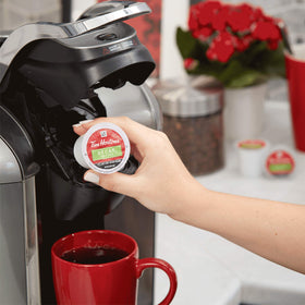 Keurig brewer with Tim Hortons Decaf K-Cups ready to brew.