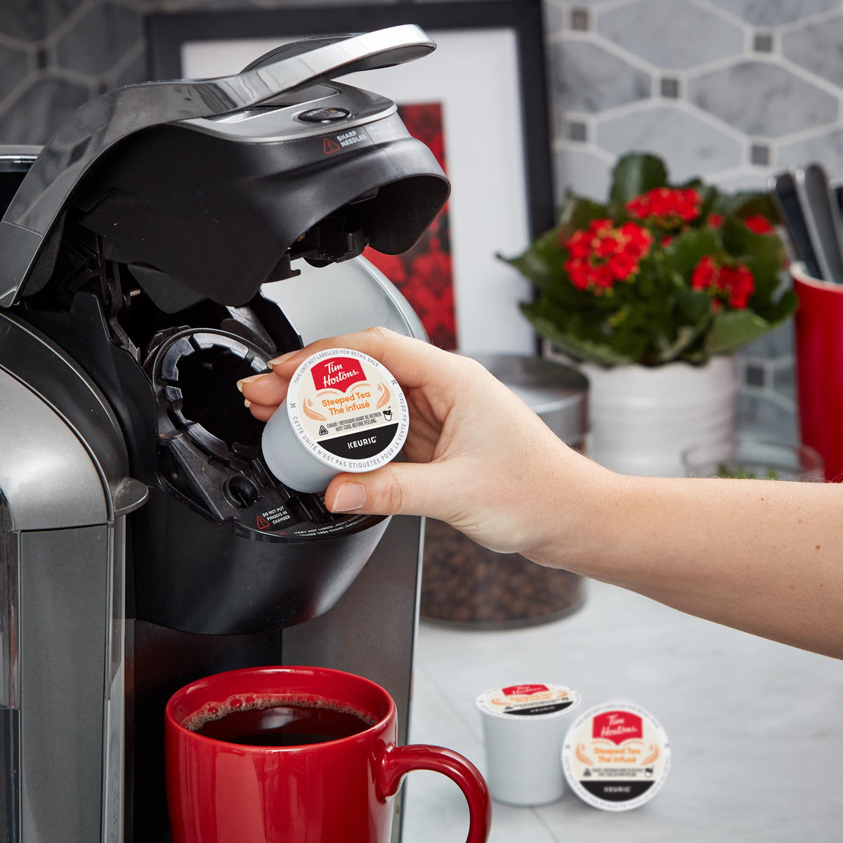Tim Hortons tea pod packaging showing recycling symbol and sustainability note