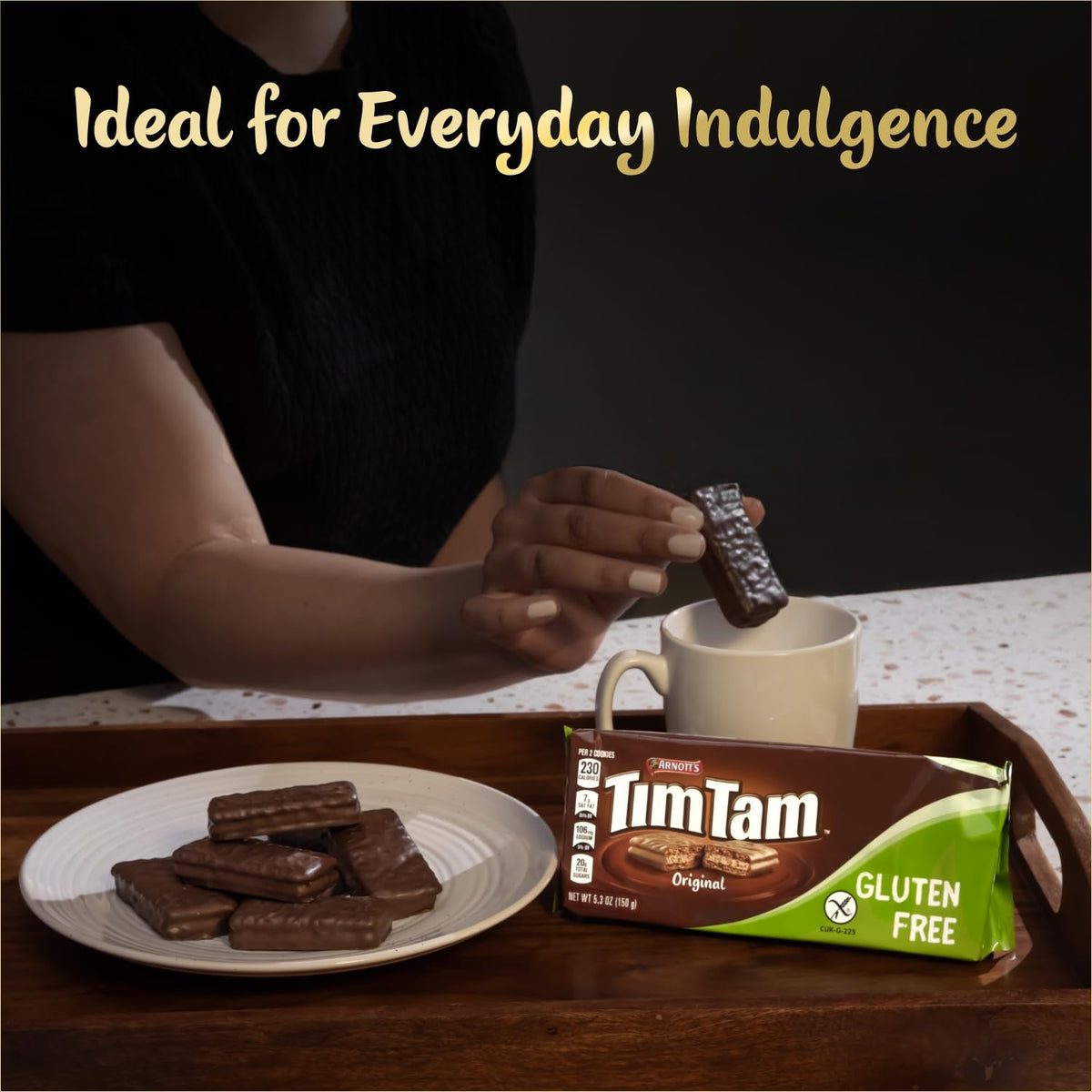 Tim Tam gluten-free original cookies beside a coffee cup for pairing.