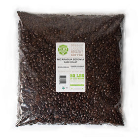 Tiny Footprint Coffee bag with label emphasizing carbon-negative commitment for eco-conscious mornings