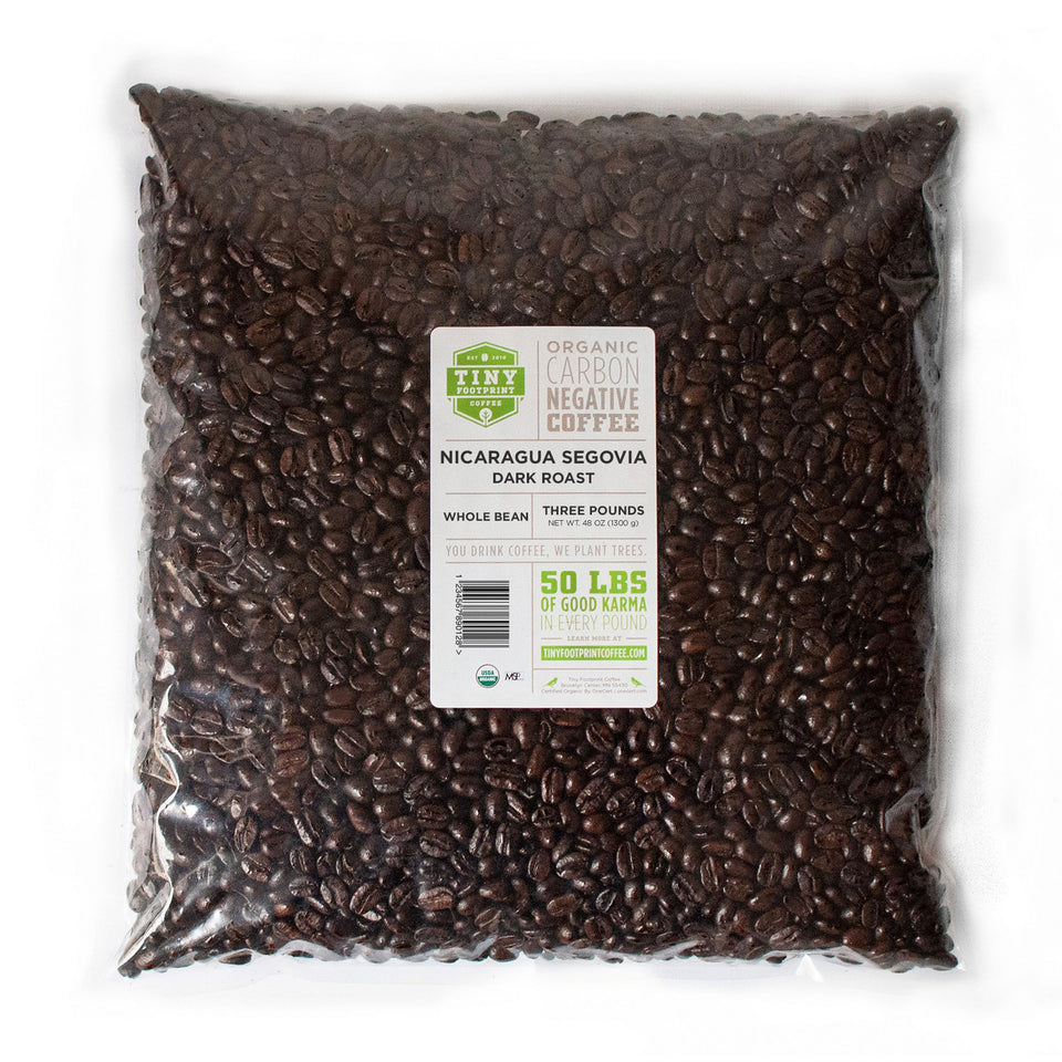 Tiny Footprint Coffee bag with label emphasizing carbon-negative commitment for eco-conscious mornings
