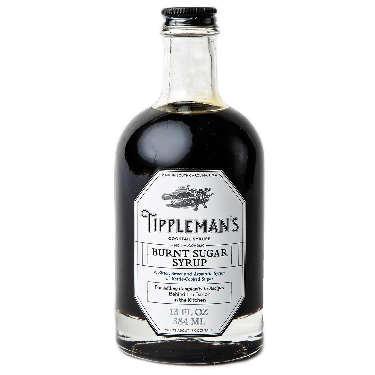 Tippleman's Burnt Sugar Syrup bottle on the bar adds deep, bittersweet flavor.