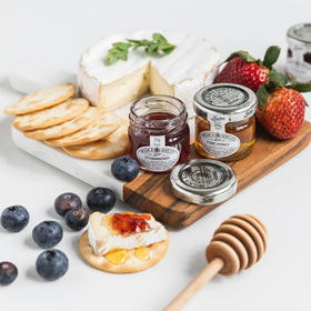 Tiptree Minis open jar showing rich strawberry spread and aroma
