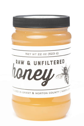 TJO Bees Raw Honey jar side view shows golden color ideal for drizzle on toast