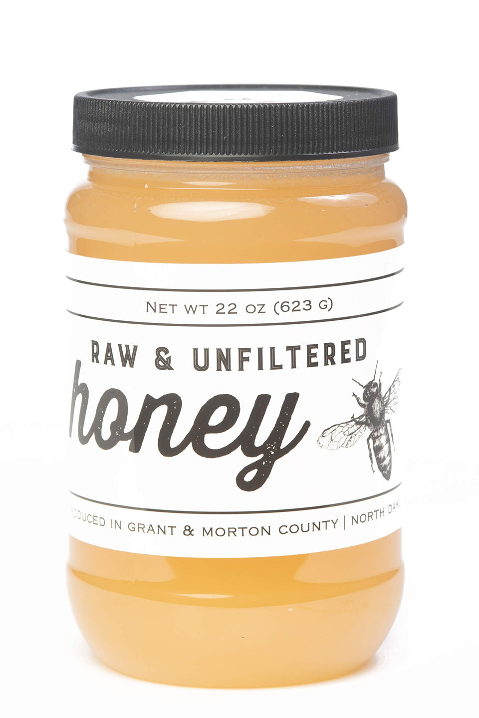 TJO Bees Raw Honey jar side view shows golden color ideal for drizzle on toast