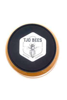 TJO Bees Raw Honey pour image shows easy measuring for cooking and baking