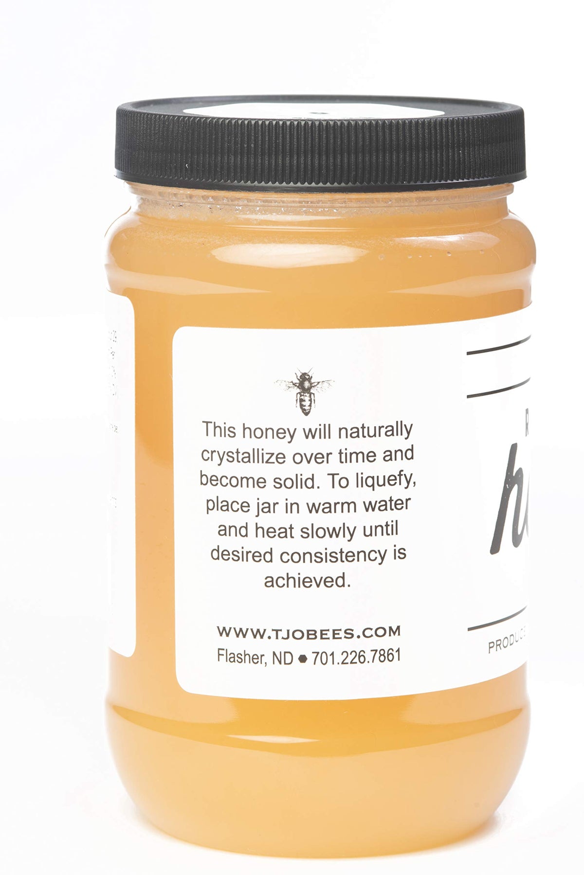 TJO Bees Raw Honey spoon dipping demonstrates smooth drizzle for yogurt and oatmeal