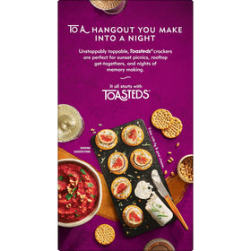 Toasteds Harvest Wheat crackers on a snack board with dips.