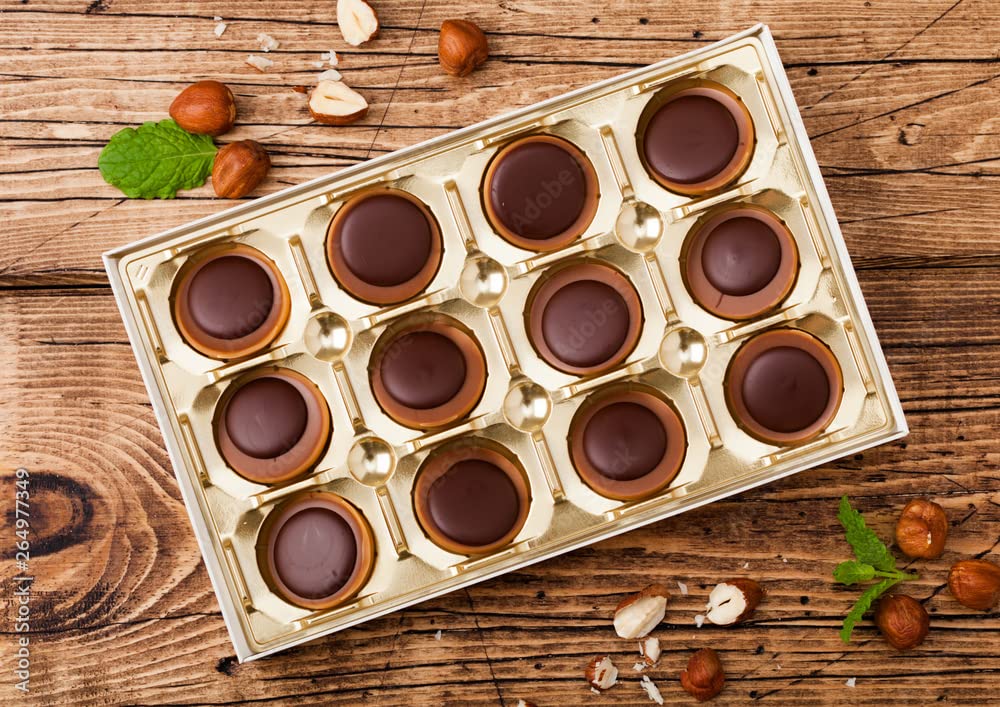 Toffifee hazelnut center surrounded by caramel in a chocolate cup, ideal for sharing.