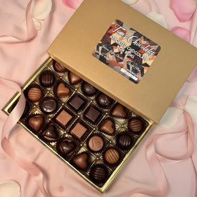 Tom's Chocolates elegant packaging on table, ideal for celebrations