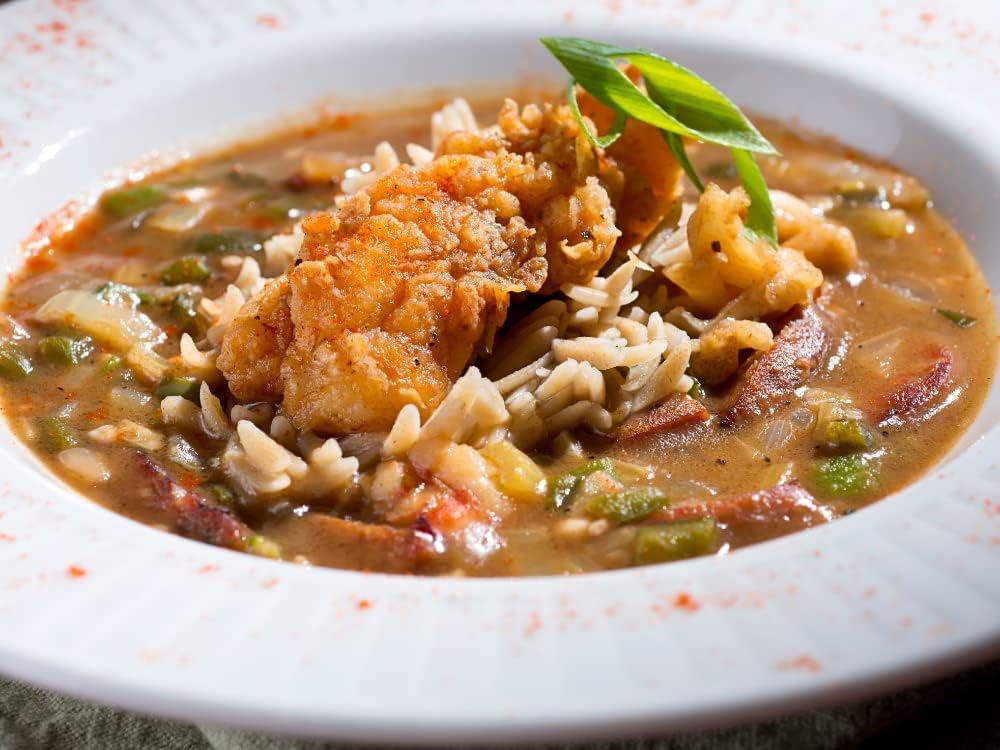 Tony Chachere's Creole seasoning on food to enhance meals.