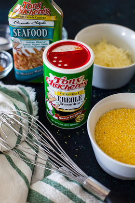 Close-up of Tony Chachere's Original Creole Seasoning, bold herbs and spices.