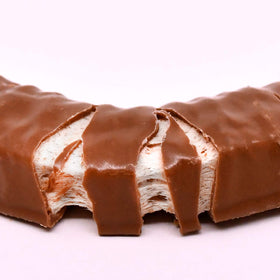 Close-up of vanilla Charleston Chew bar with rich chocolate coating.