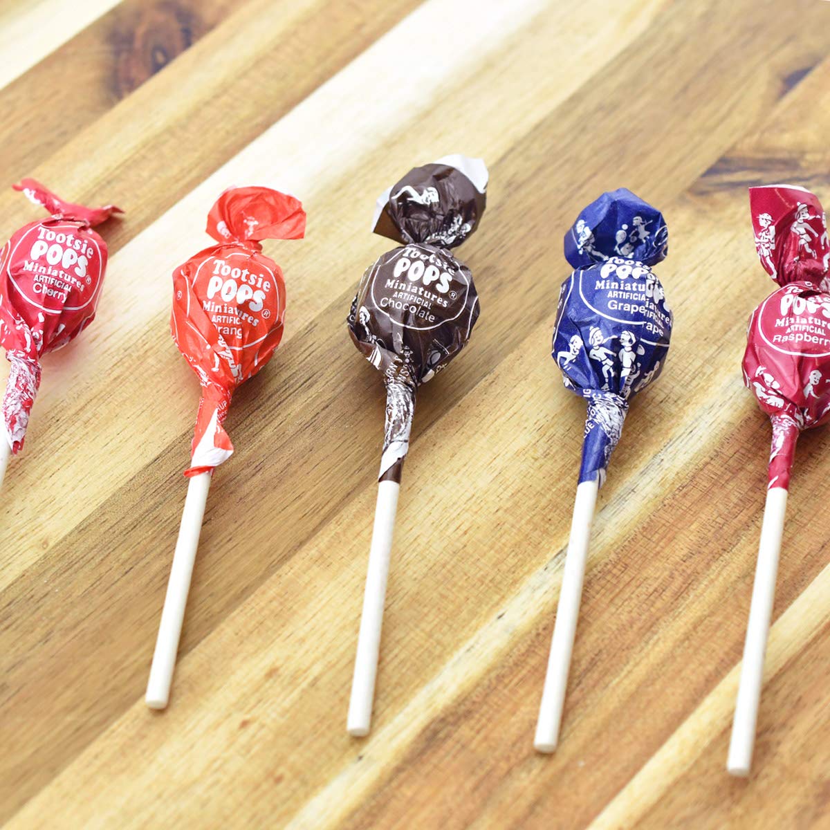 Tootsie Roll Pops Minis orange flavor, kid-friendly snack option.