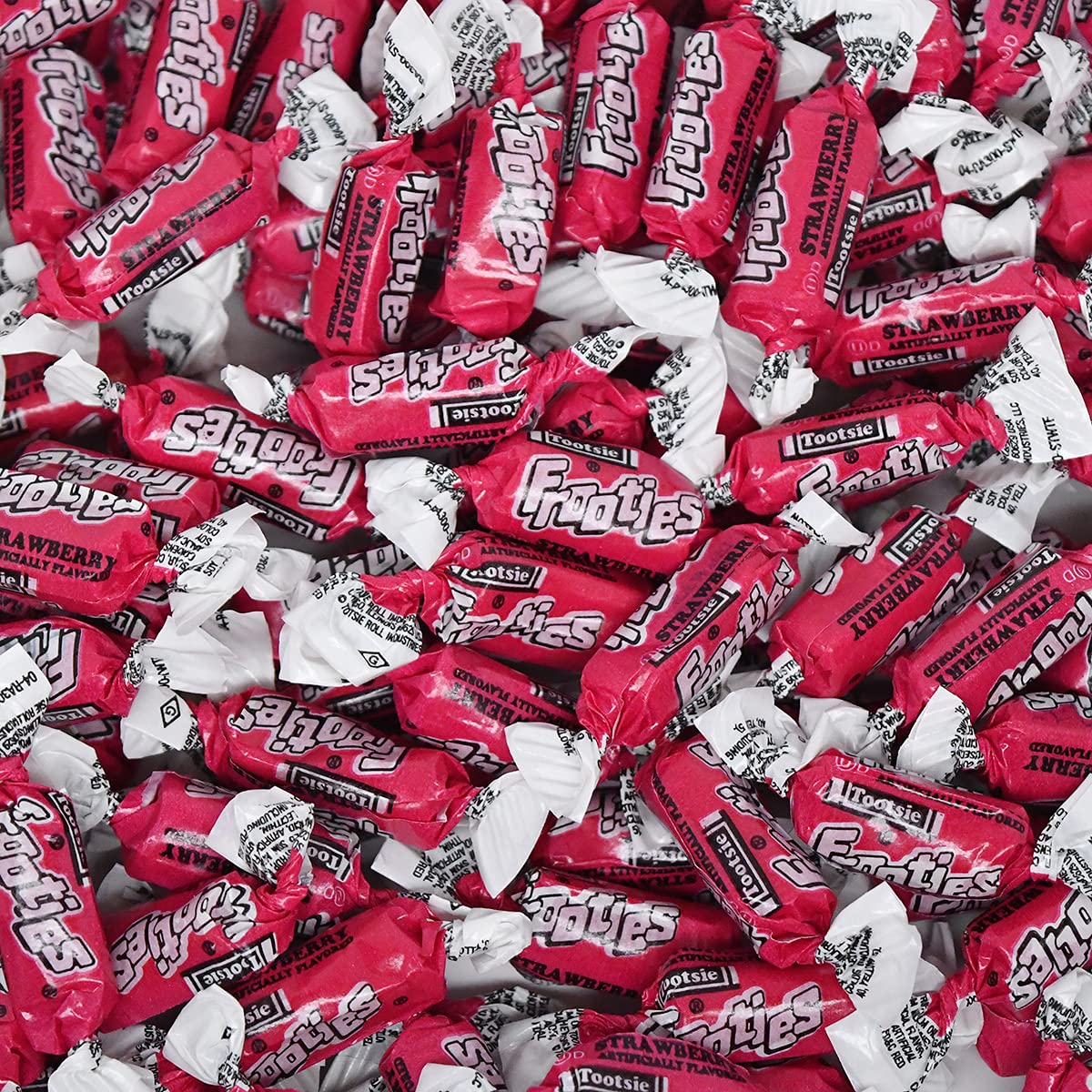 Tootsie Roll Strawberry Frooties closeup reveals bright red candy details.