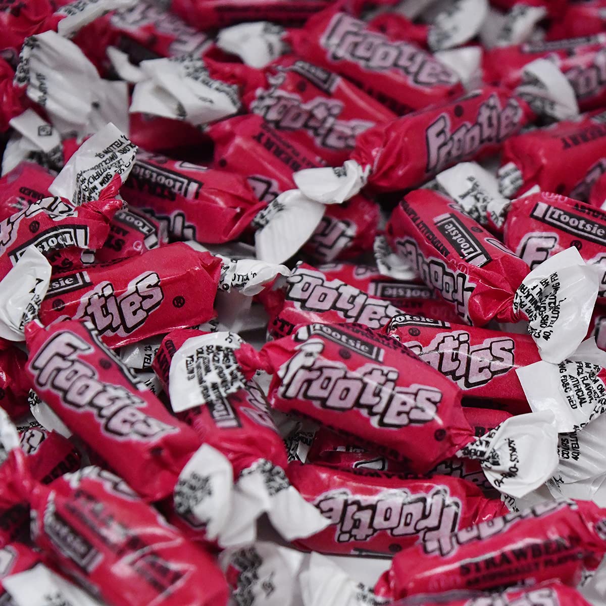 Tootsie Roll Strawberry Frooties party setup with colorful bowls.