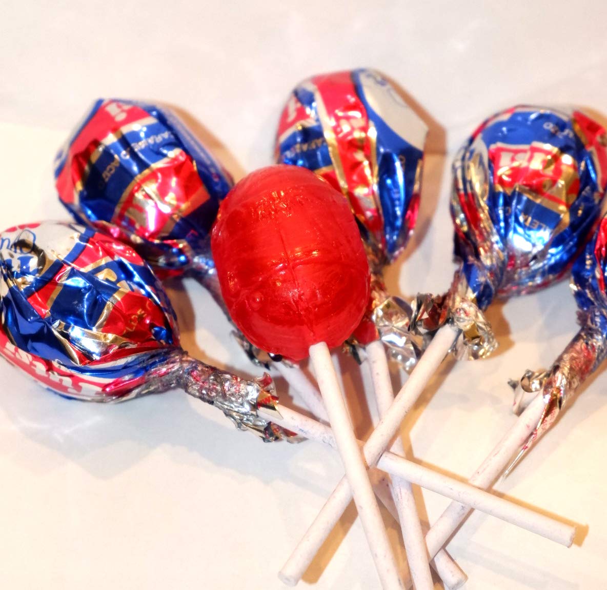 Tootsie Roll Tutsi Pop gum center close-up, showcasing tutti-frutti interior for sharing.