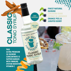 Top Hat Provisions 32oz bottle on a stylish home bar setup for effortless mixing.