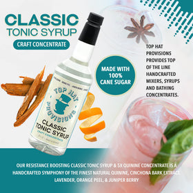 Top Hat Provisions tonic syrup beside a shaker for home mixology.
