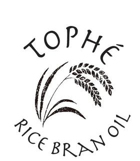 Tophé Rice Bran Oil being poured emphasizes smooth emulsification for dressings.