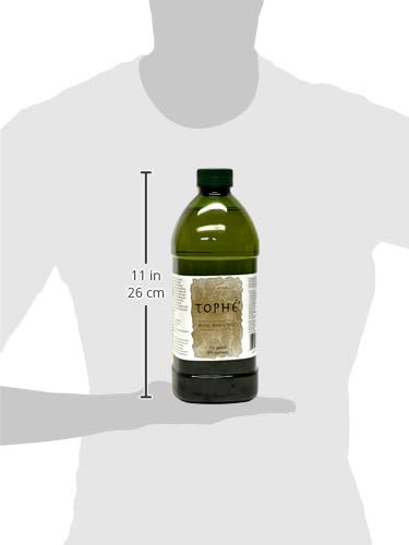 Tophé Rice Bran Oil close-up reveals golden, unfiltered texture and natural flavor.