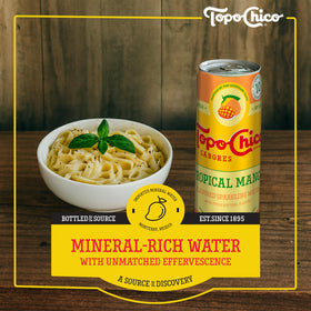 Close-up of Topo Chico Sabores Tropical Mango bubbles and real fruit juice
