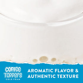 Closeup of vanilla foam atop a latte with latte art