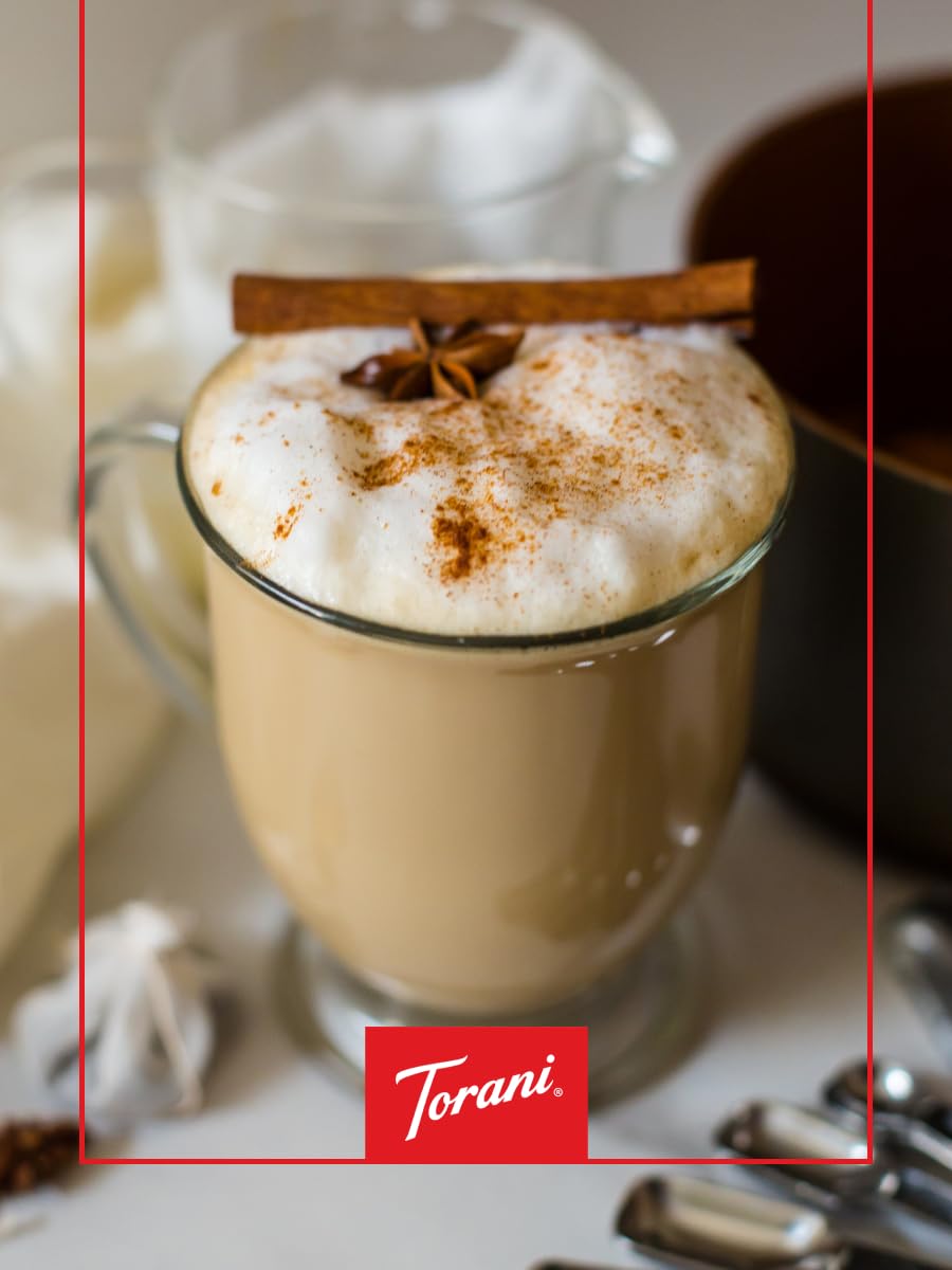 Torani Amaretto Syrup close-up pouring over crema.