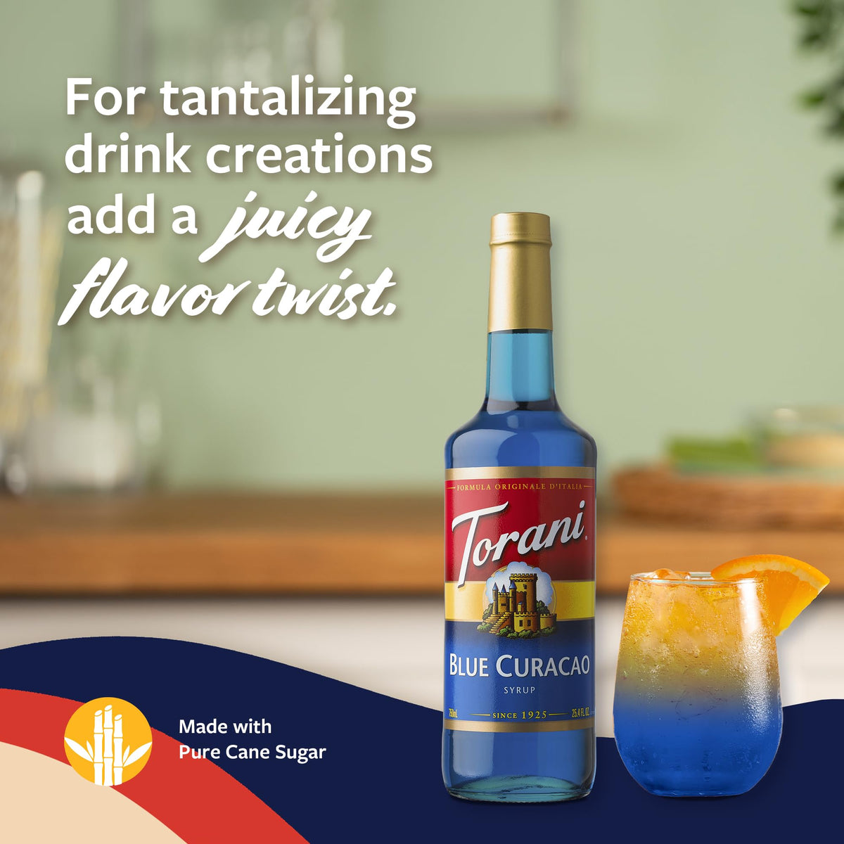 Pouring Torani Blue Curacao Syrup into a refreshing blue cocktail.