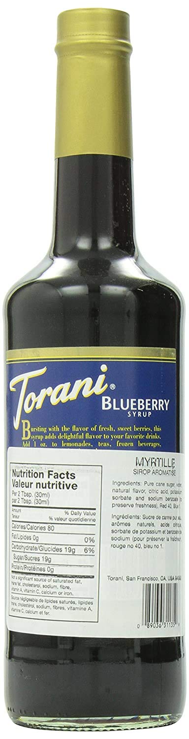 Torani Blueberry Syrup being poured into a glass to elevate drinks.