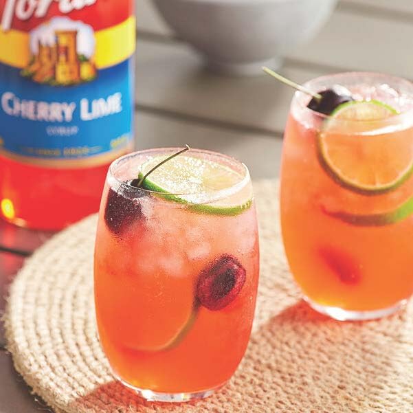 Torani Cherry Lime pour in a glass shows bright flavor.