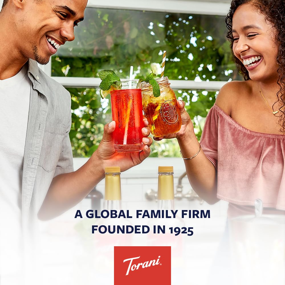 Torani Cherry Syrup bottle in a cafe setup showcasing versatility.