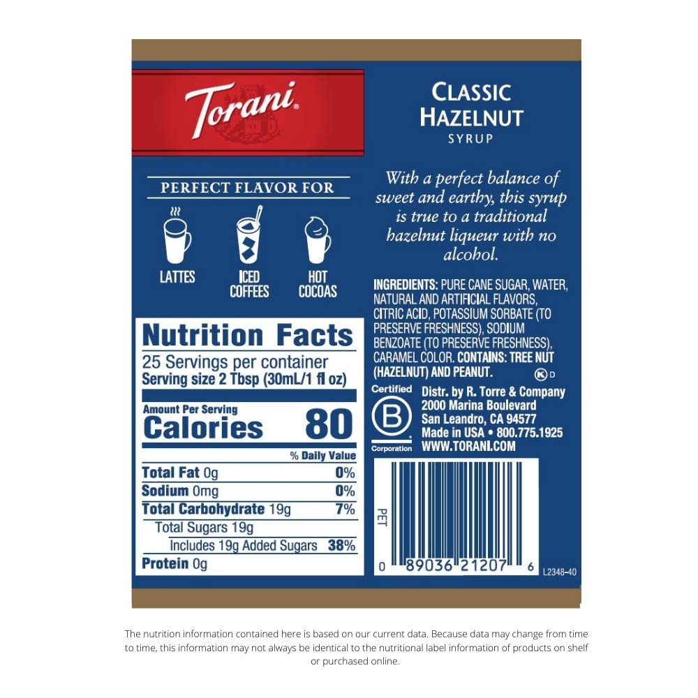 Torani Classic Hazelnut Syrup beside a coffee mug for morning flavor.