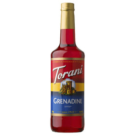 Torani Grenadine syrup bottle on counter for premium drink flavoring.