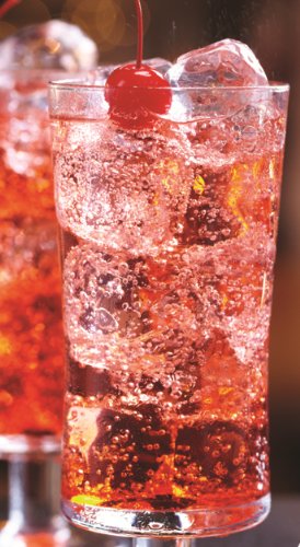 Torani Grenadine syrup pours into a glass for vibrant drinks.