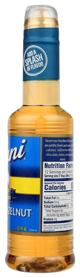 Four-pack Torani hazelnut sugar-free syrup on a kitchen shelf.