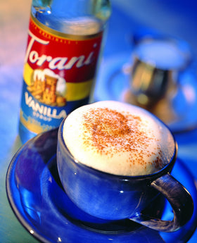 Torani Hazelnut Syrup glass-dessert setting highlights creamy, toasted notes.