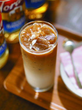 Torani Hazelnut Syrup label closeup shows pure cane sugar.