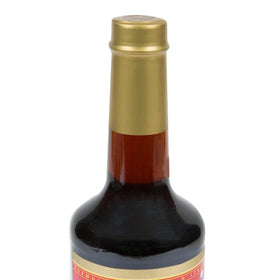Torani Maple Syrup 750 mL label close-up shows premium flavor and recognizable branding.