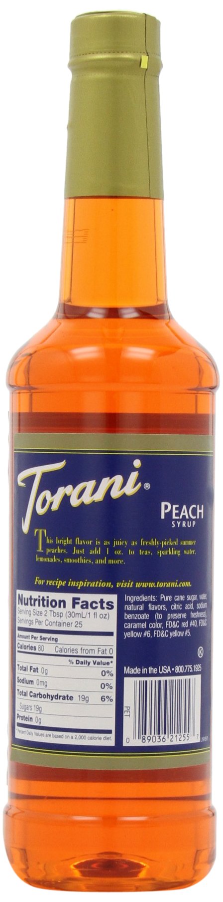 Torani peach syrup bottle with glass of iced tea, showcasing versatility.
