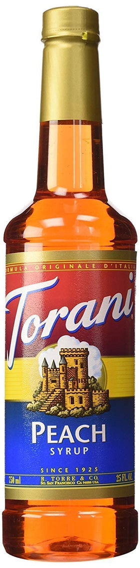 Torani Peach Syrup being poured into a glass for peachy drinks