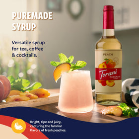 Pouring Torani Peach Syrup over ice into a refreshing drink