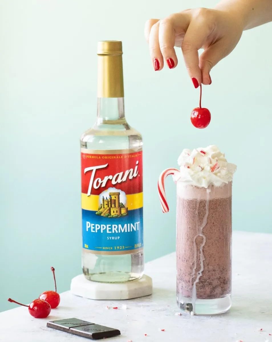 Torani Peppermint Syrup bottle pour capturing refreshing mint aroma for drinks
