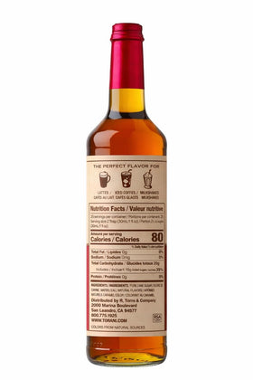 Pour shot demonstrates caramel syrup drizzle ideal for lattes.